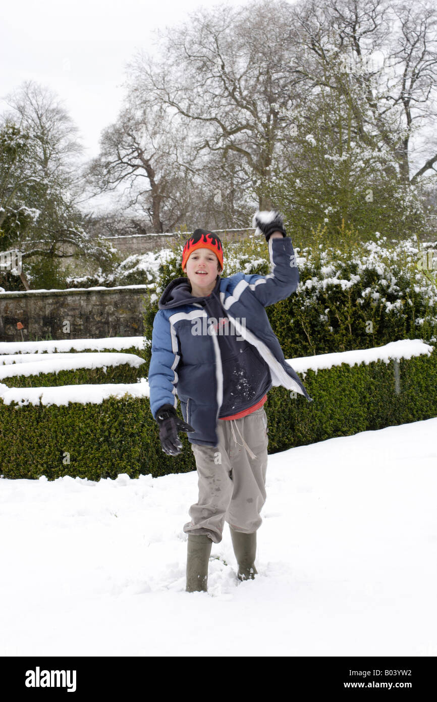 snowball fight Boy about to throw a snowball Stock Photo