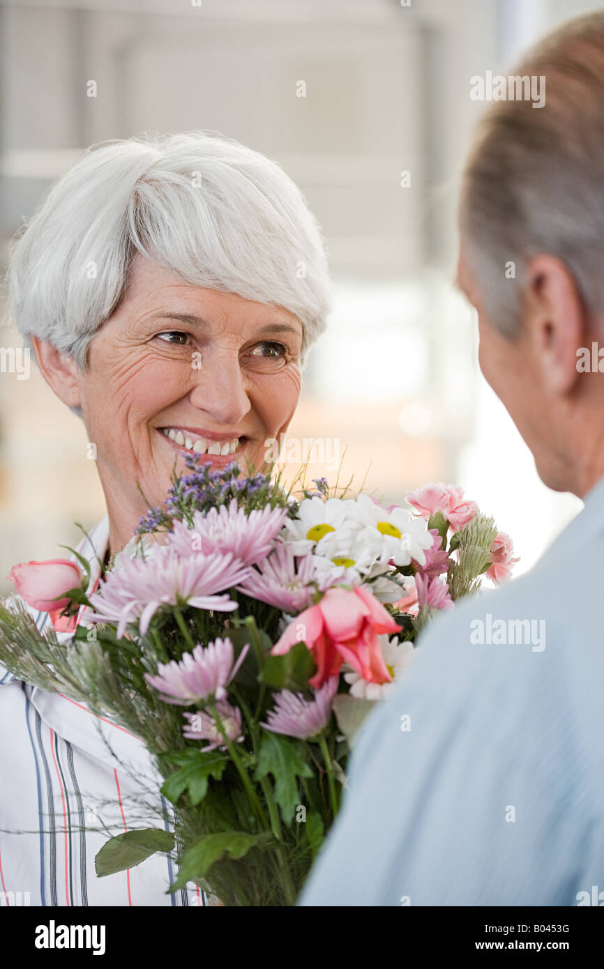 Cropped View Man Giving Pink Flower Bouquet Woman Isolated Grey Stock Photo  by ©AndrewLozovyi 229724242