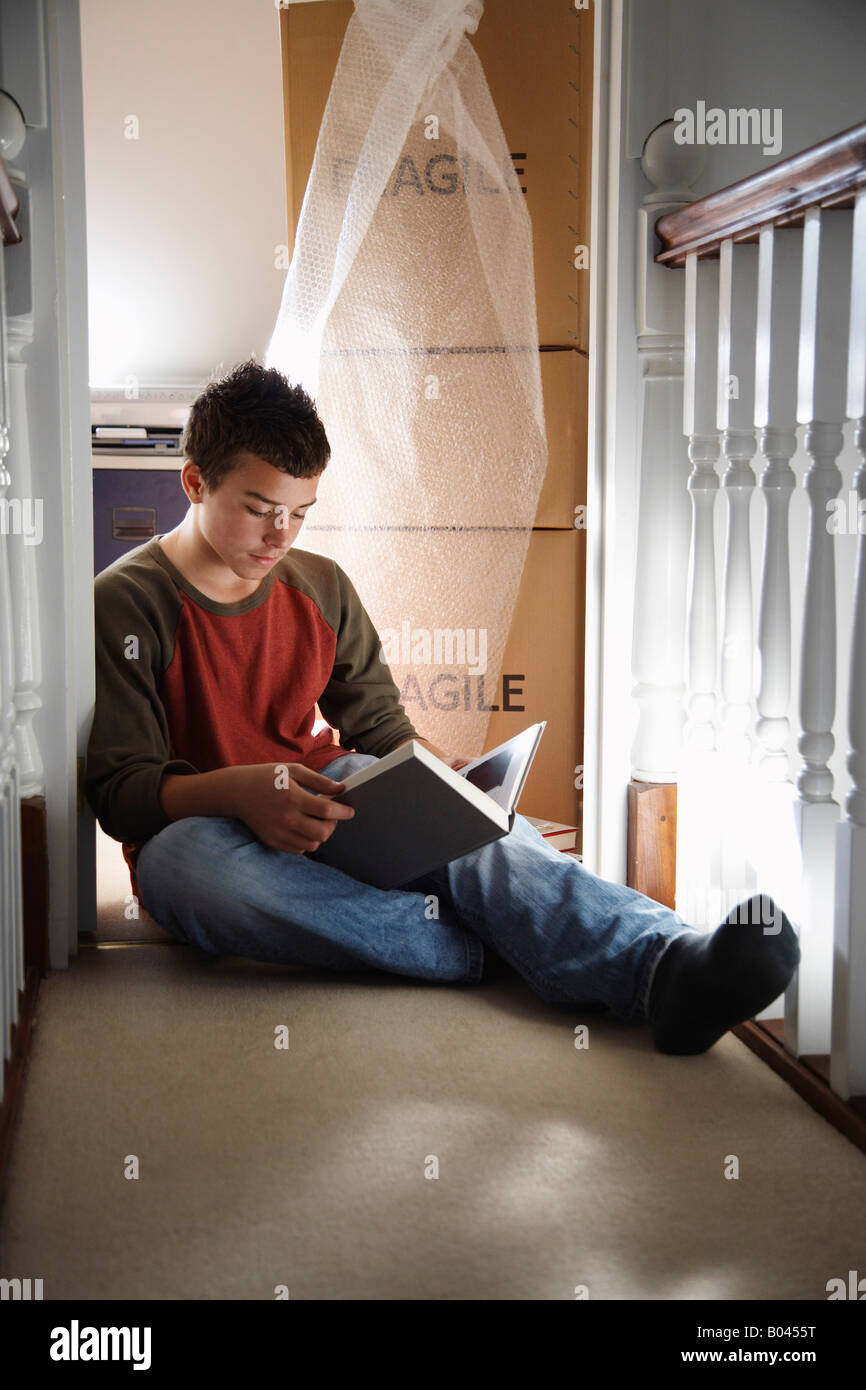 One teen boy sitting denim hi-res stock 