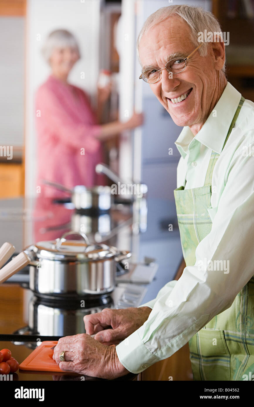 Senior man cooking Stock Photo Alamy