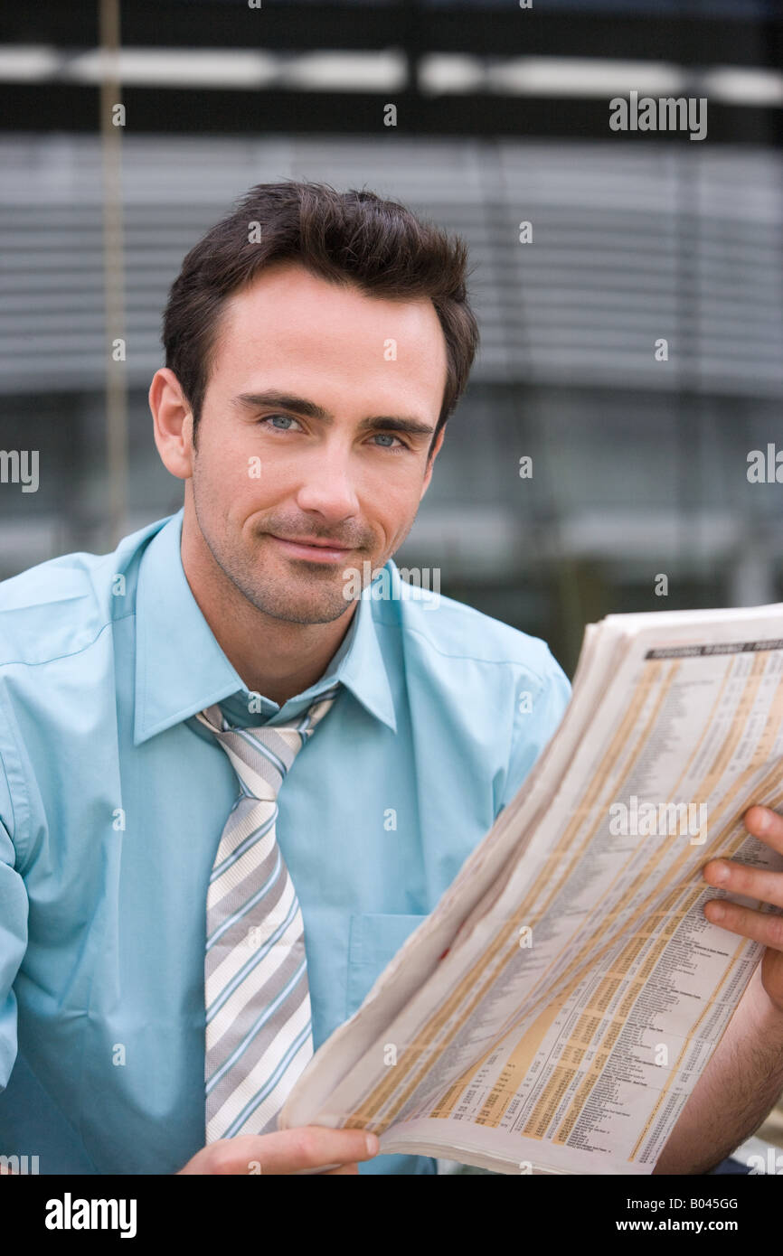 Office worker reading a newspaper Stock Photo Alamy