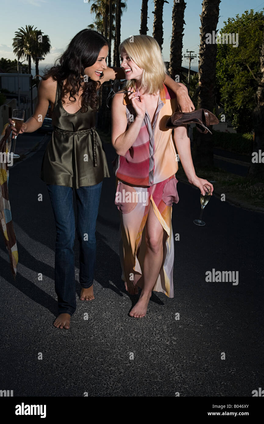 Woman walking barefoot street hi-res stock photography and images - Alamy