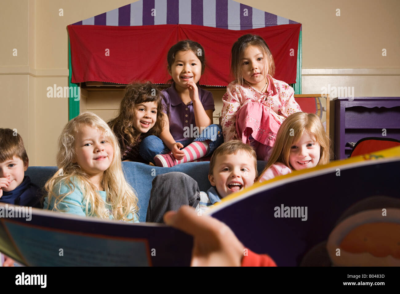 A teacher telling her class a story Stock Photo Alamy