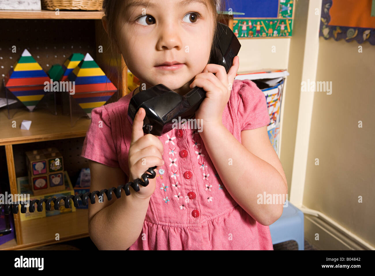 A girl using a telephone Stock Photo Alamy
