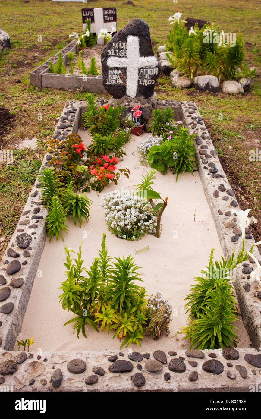 Graves with flowers on All Saints Day at Hanga Roa cemetery by the sea
