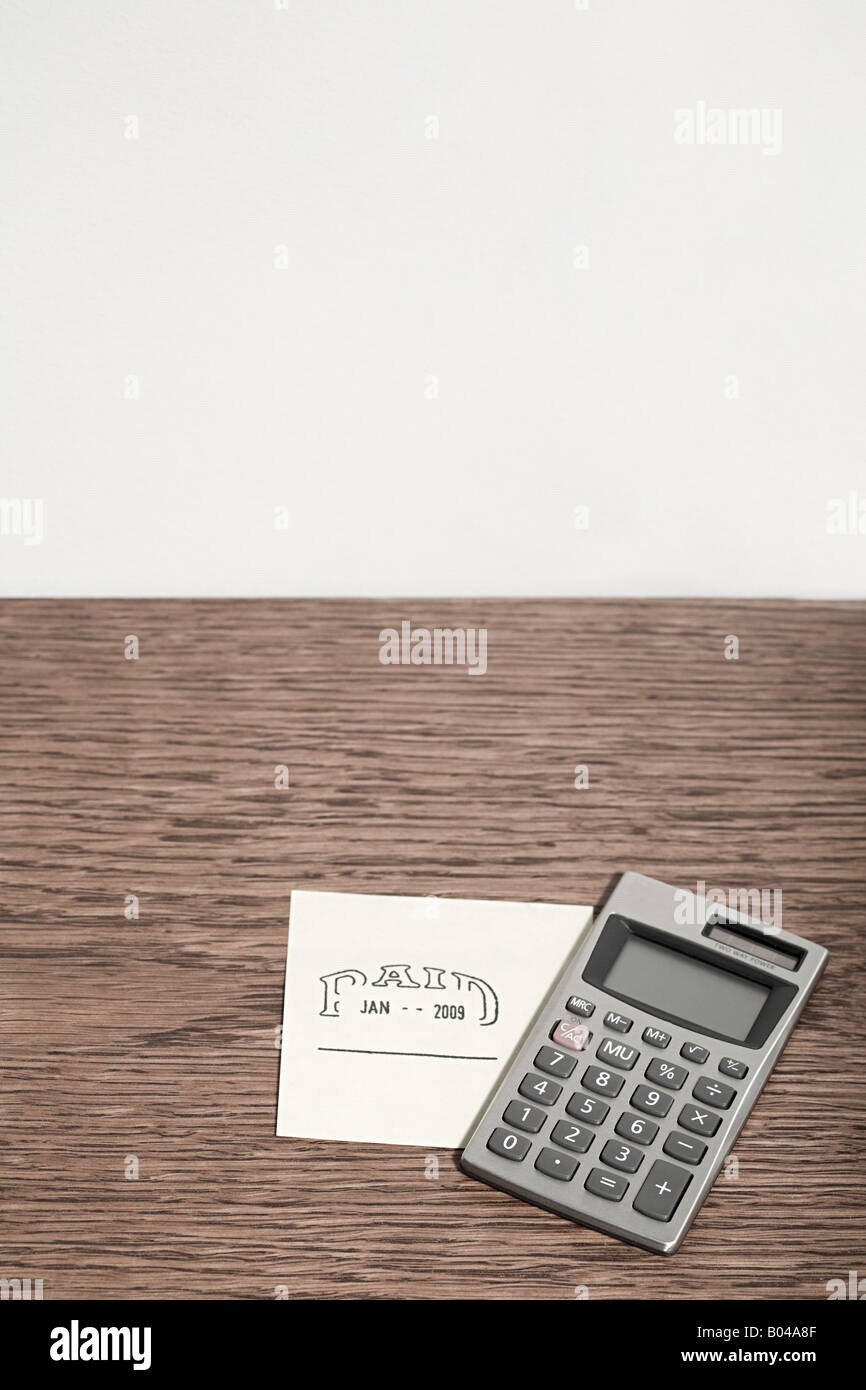 Adhesive note and calculator Stock Photo