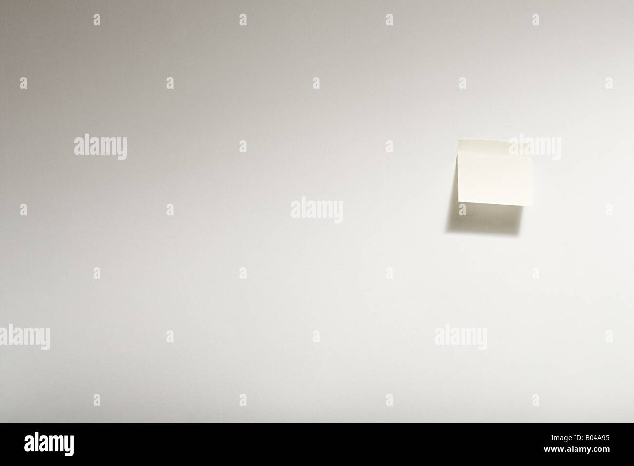 Adhesive note on wall Stock Photo