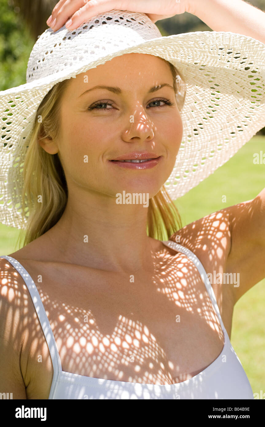 Portrait of a woman wearing a sun hat Stock Photo - Alamy