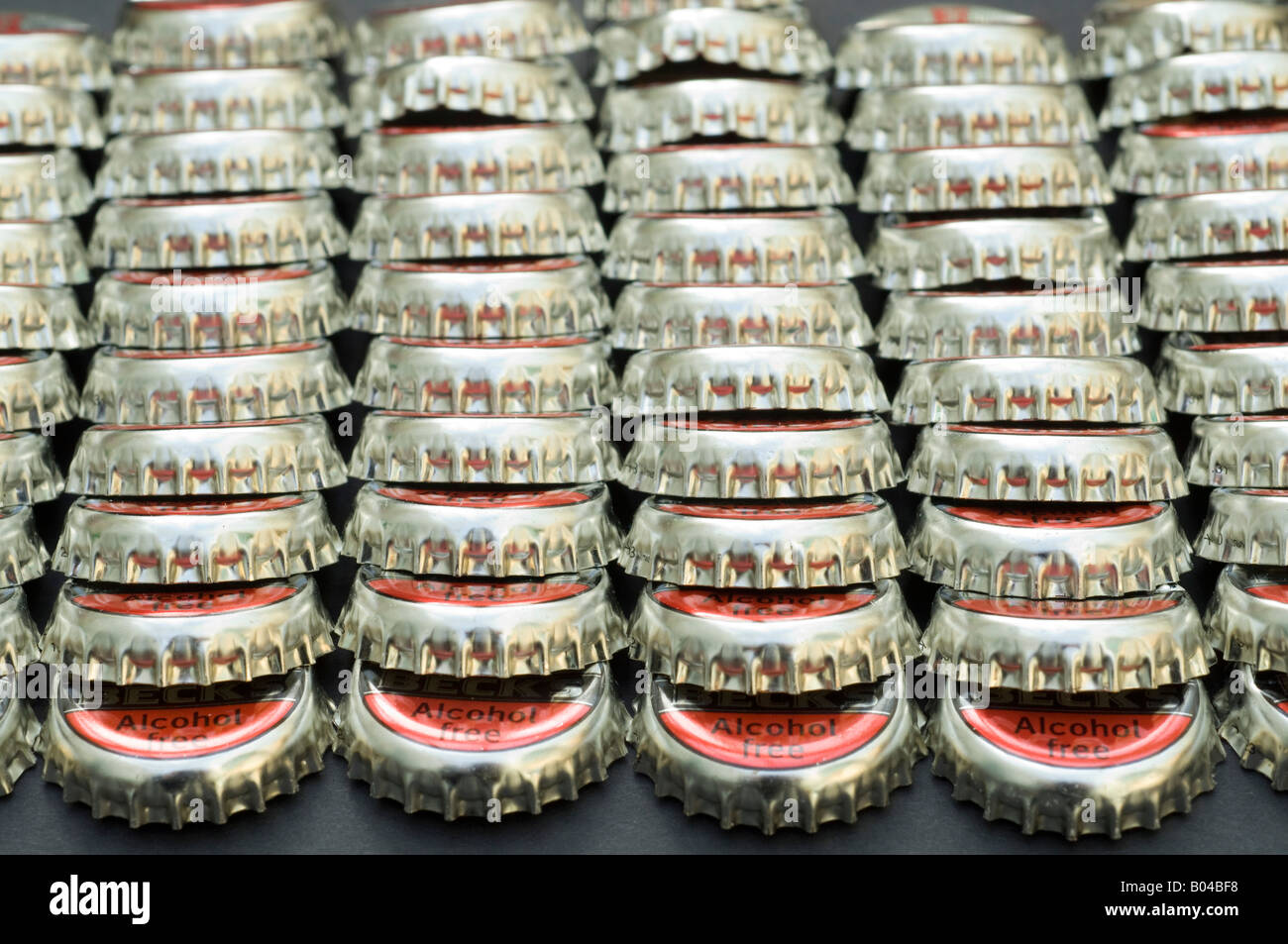 Rows of Becks alcohol free beer bottletops Stock Photo
