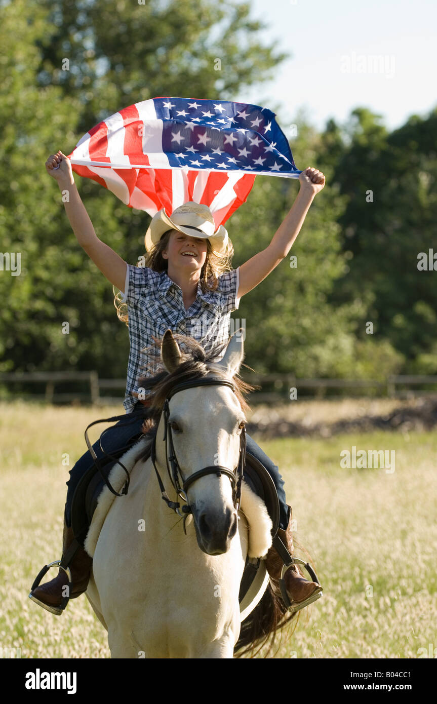 A girl holding the american flag Stock Photo