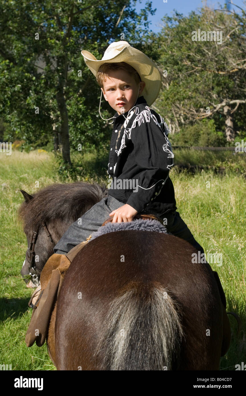 A boy riding a horse Stock Photo