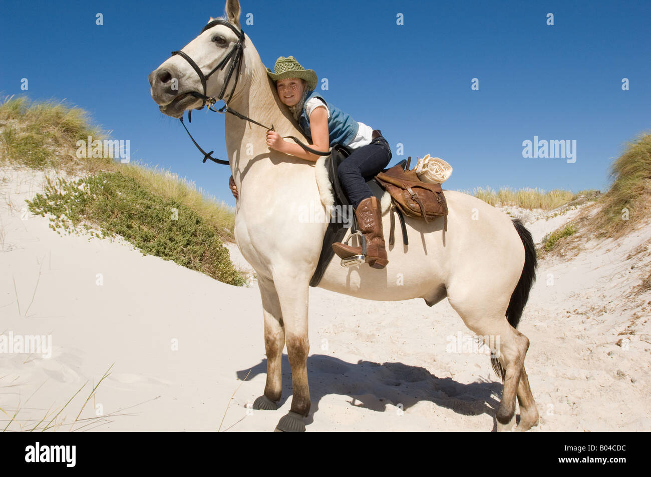 A girl riding a horse Stock Photo