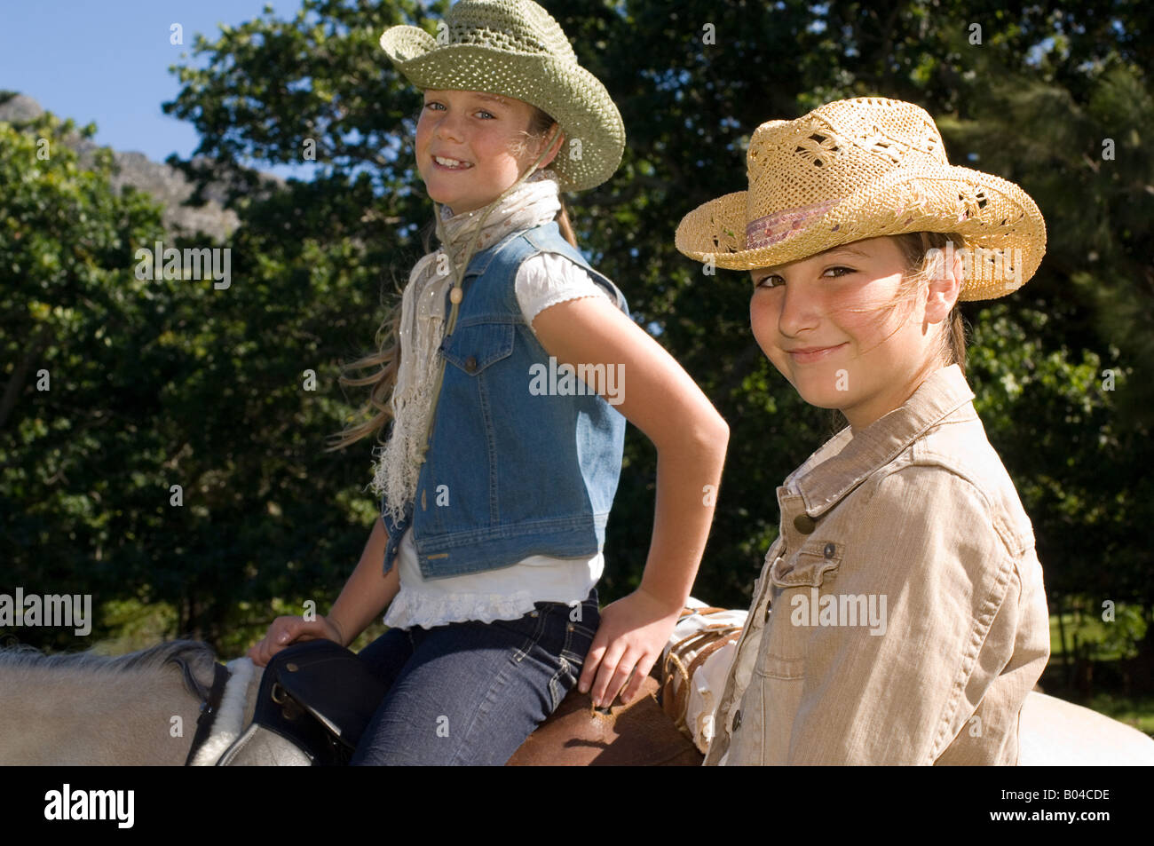 Two girls riding horses Stock Photo