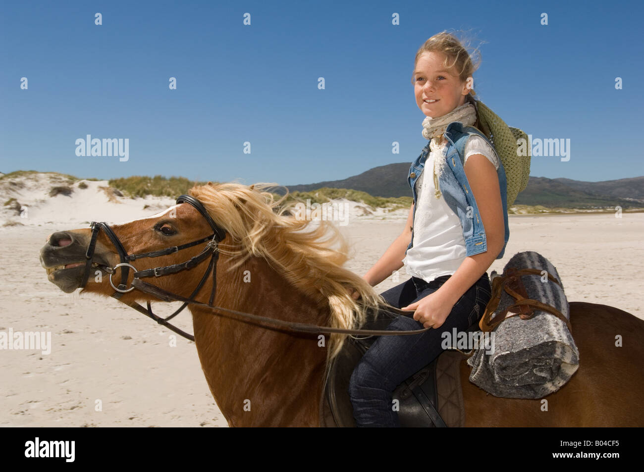 A girl riding a horse Stock Photo