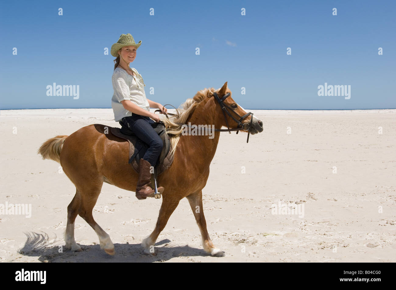 A girl riding a horse Stock Photo