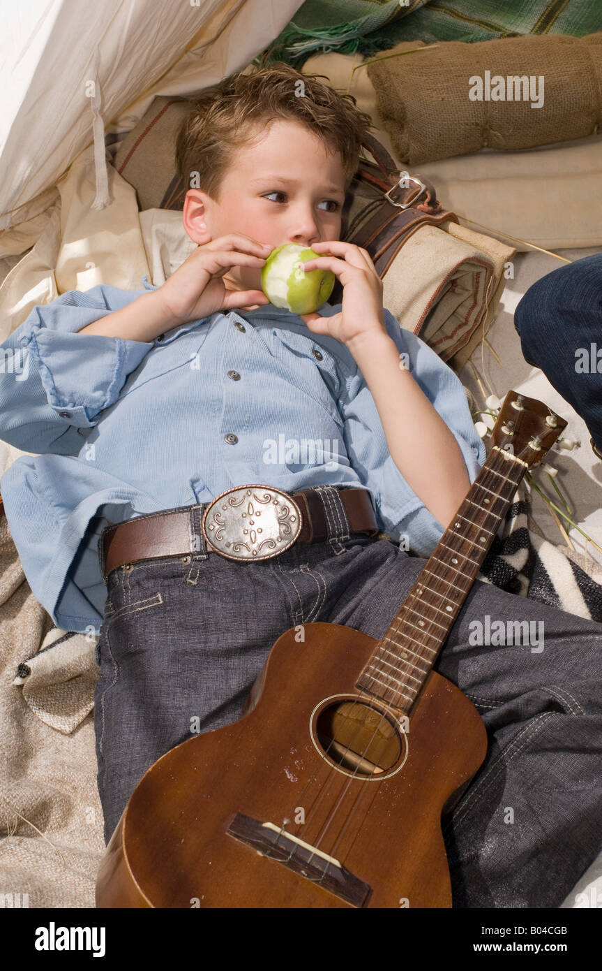 A boy eating an apple Stock Photo