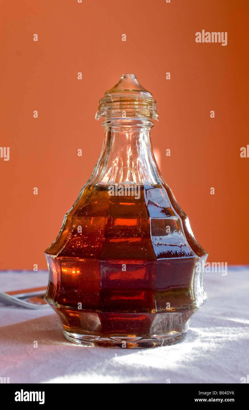 bottle of vinegar on dining table Stock Photo Alamy