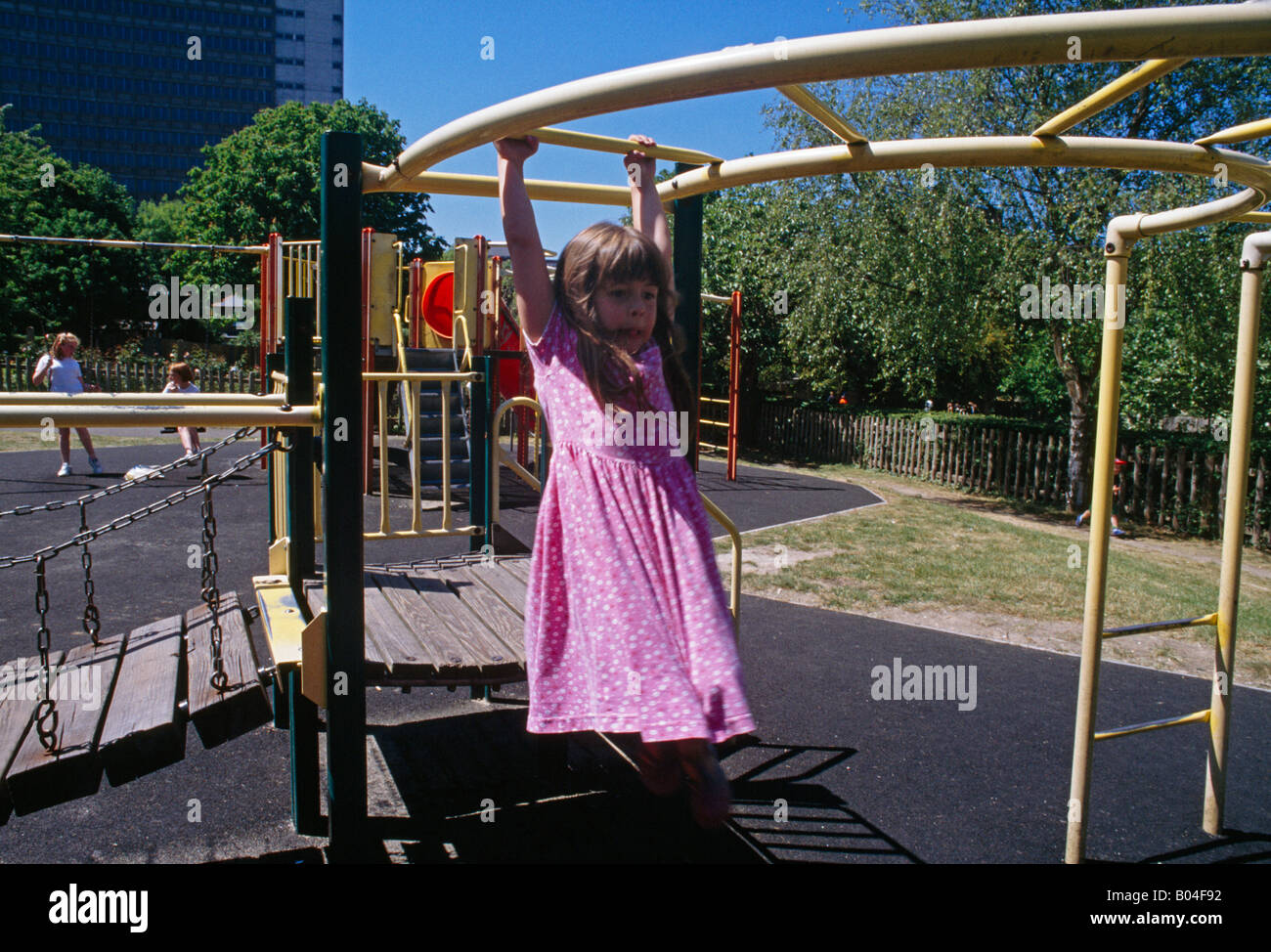 Child In Playground On Climbing Frame Stock Photo