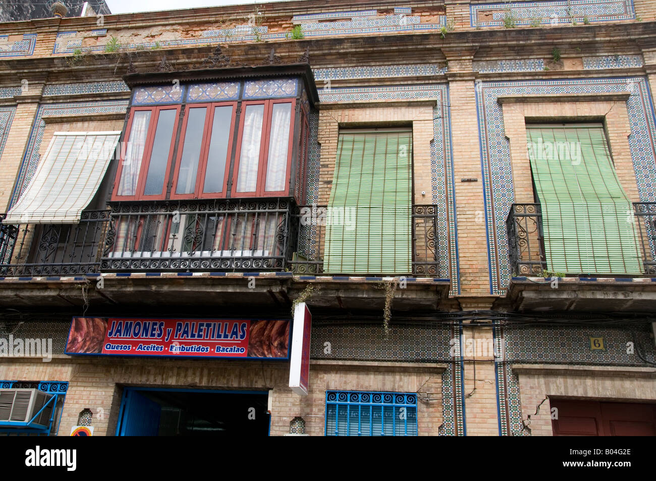 Spain Andalucia April 2008 Huelva Old houses with window blinds down Stock Photo