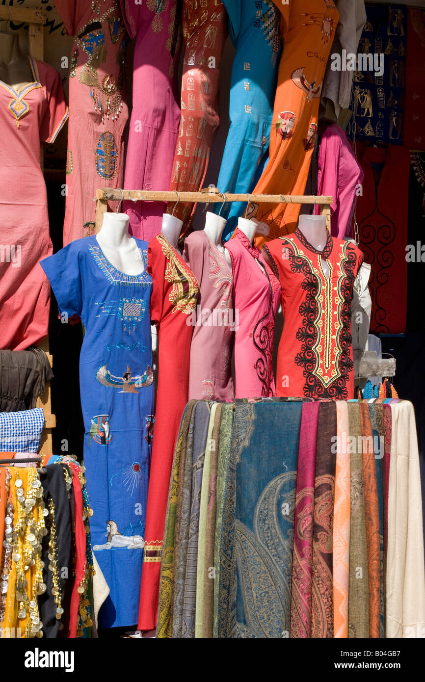 Vibrant coloured silks and cottons in the bazaar of Aswan, Egypt Stock Photo