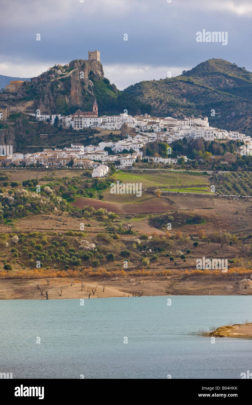 White town of Zahara de la Sierra fanning out below the castle ruins on ...