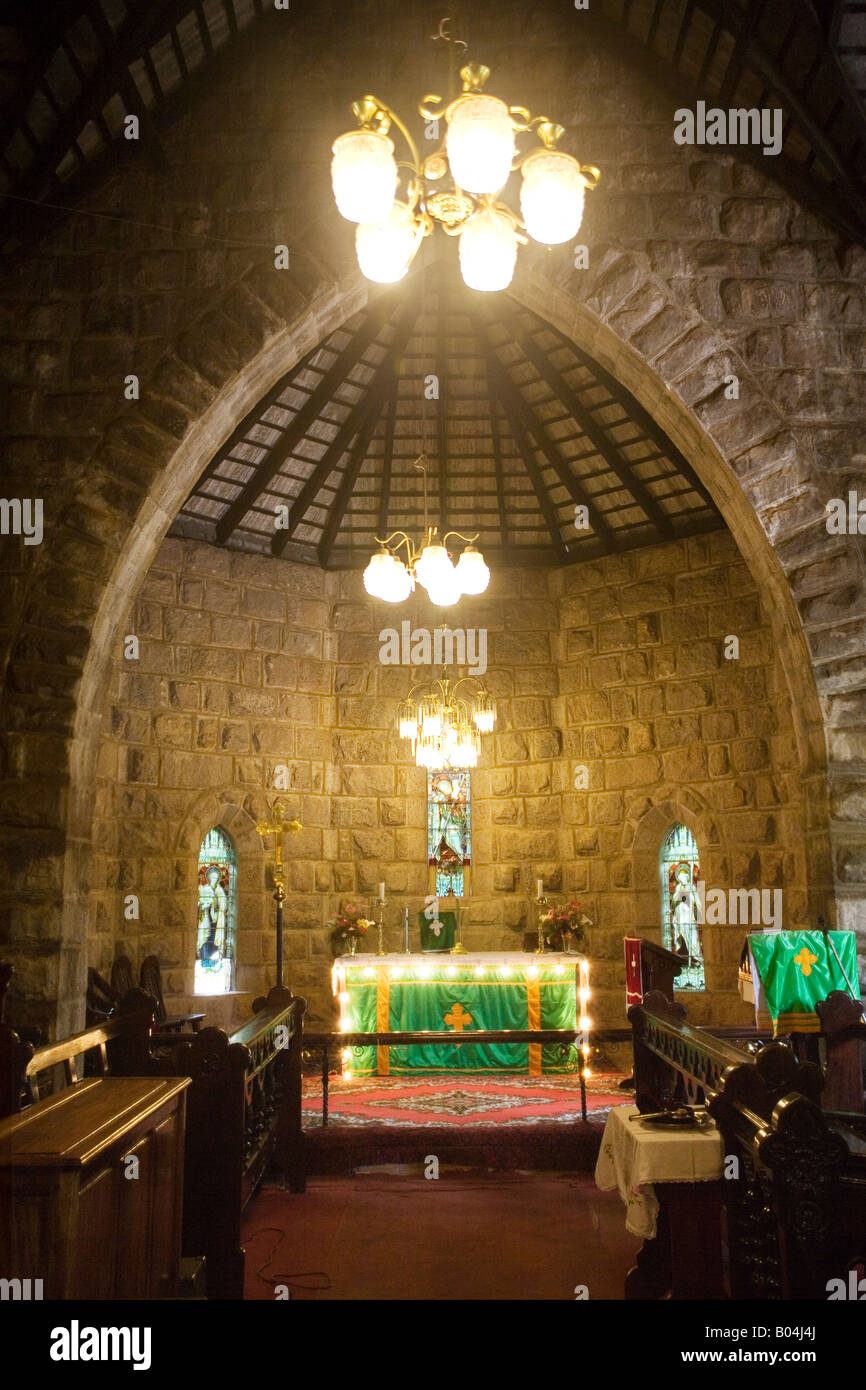 Altar and chancel with stained glass windows in Protestant Christ