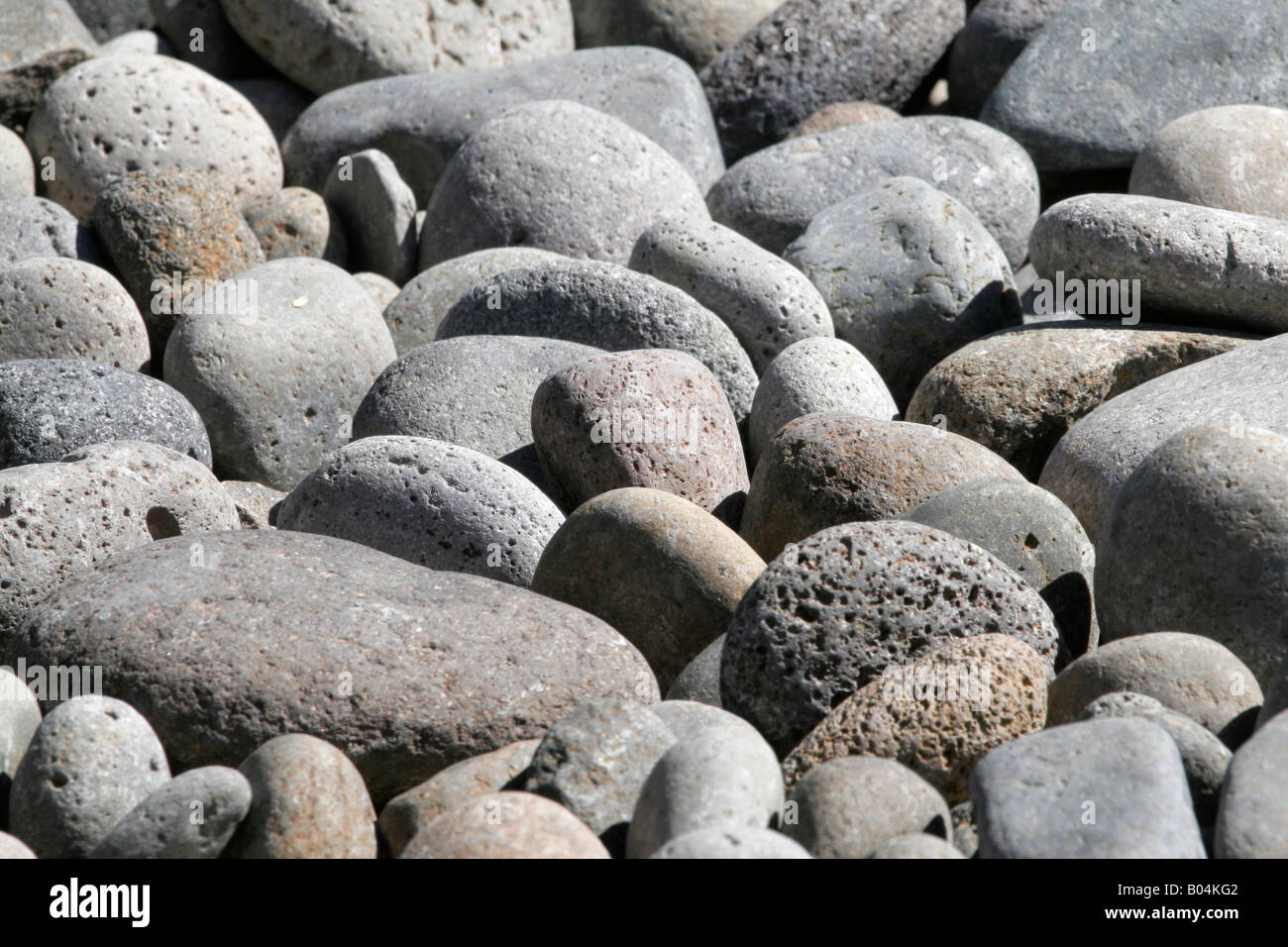 Smooth Tumbled Gray River Stones With White Stripes Stock Photo - Download  Image Now - iStock