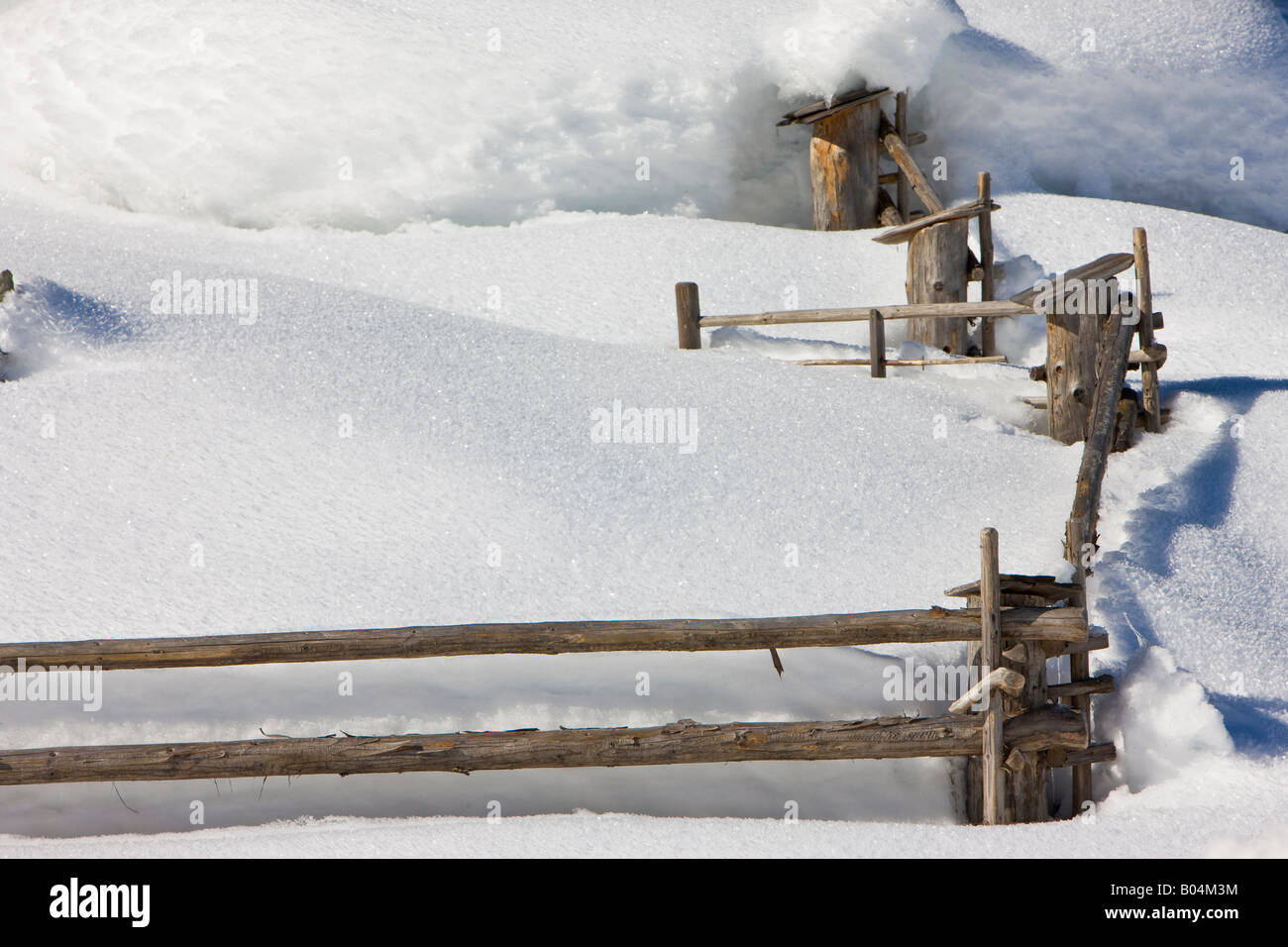 Fence surrounded by snow in the Wildgerlostal (Wildgerlos Valley), Salzburger Land, Austria, Europe. Stock Photo