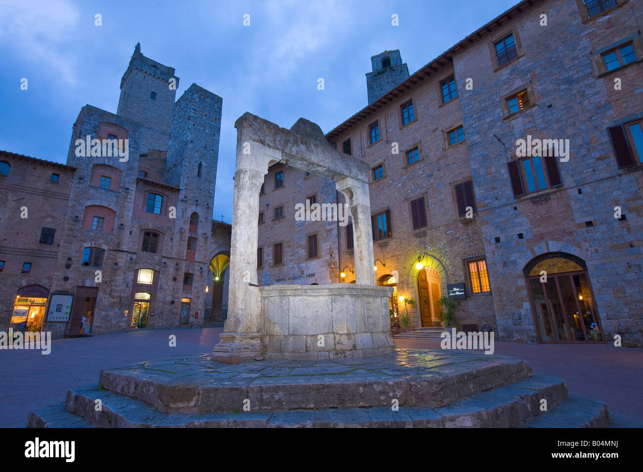 Piazza Della Cisterna At Dusk In The Historic Old Town Centre Of San piazza-della-cisterna-at-dusk-in-the-historic-old-town-centre-of-san