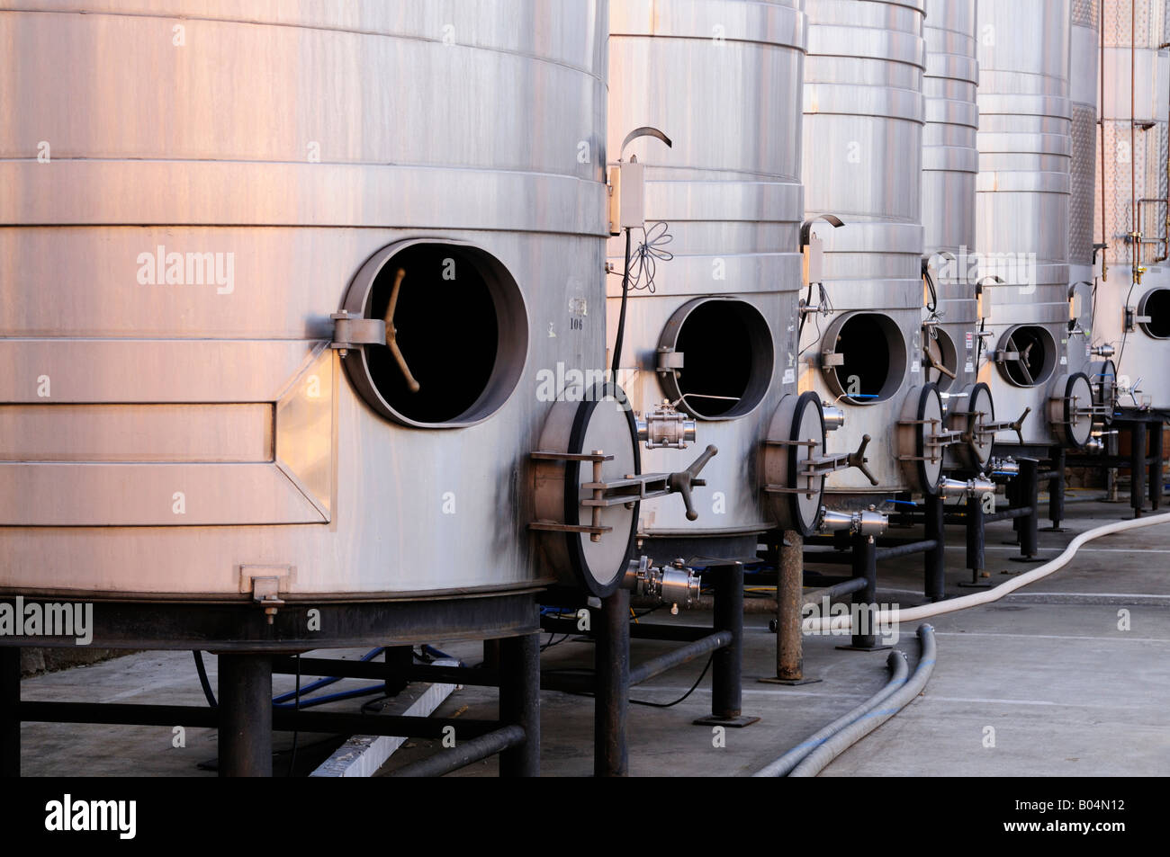 Brushed steel tanks for winemaking waiting for the new grape harvest in Napa Valley Sonoma County California Stock Photo