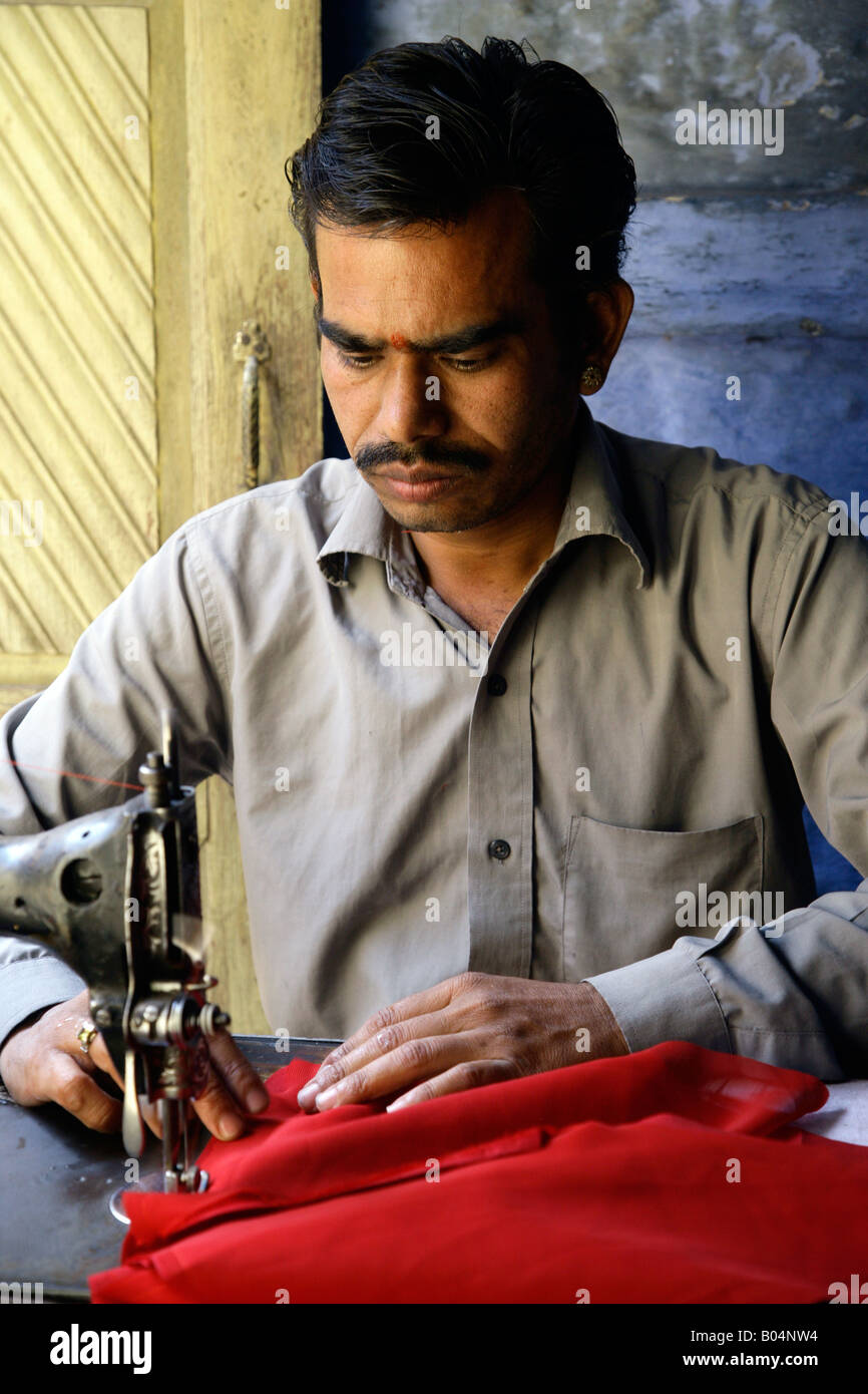 Indian man old sewing machine hires stock photography and images Alamy