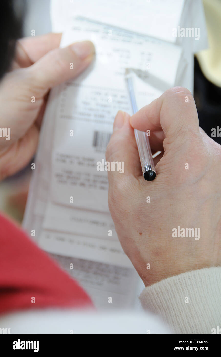 woman going through receipts Stock Photo