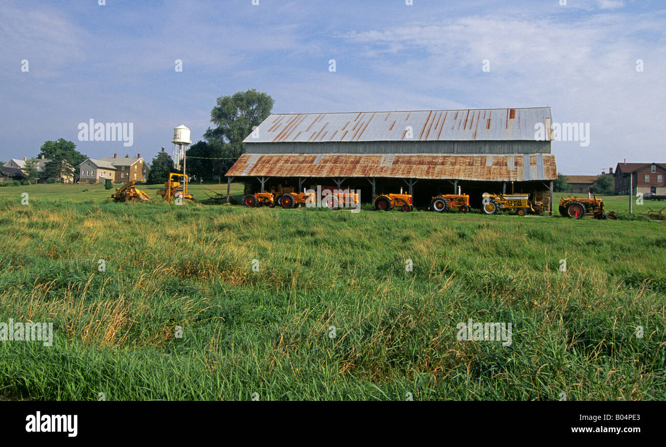 Tractors lined up at a farm and old barn in West Amana in the Amana