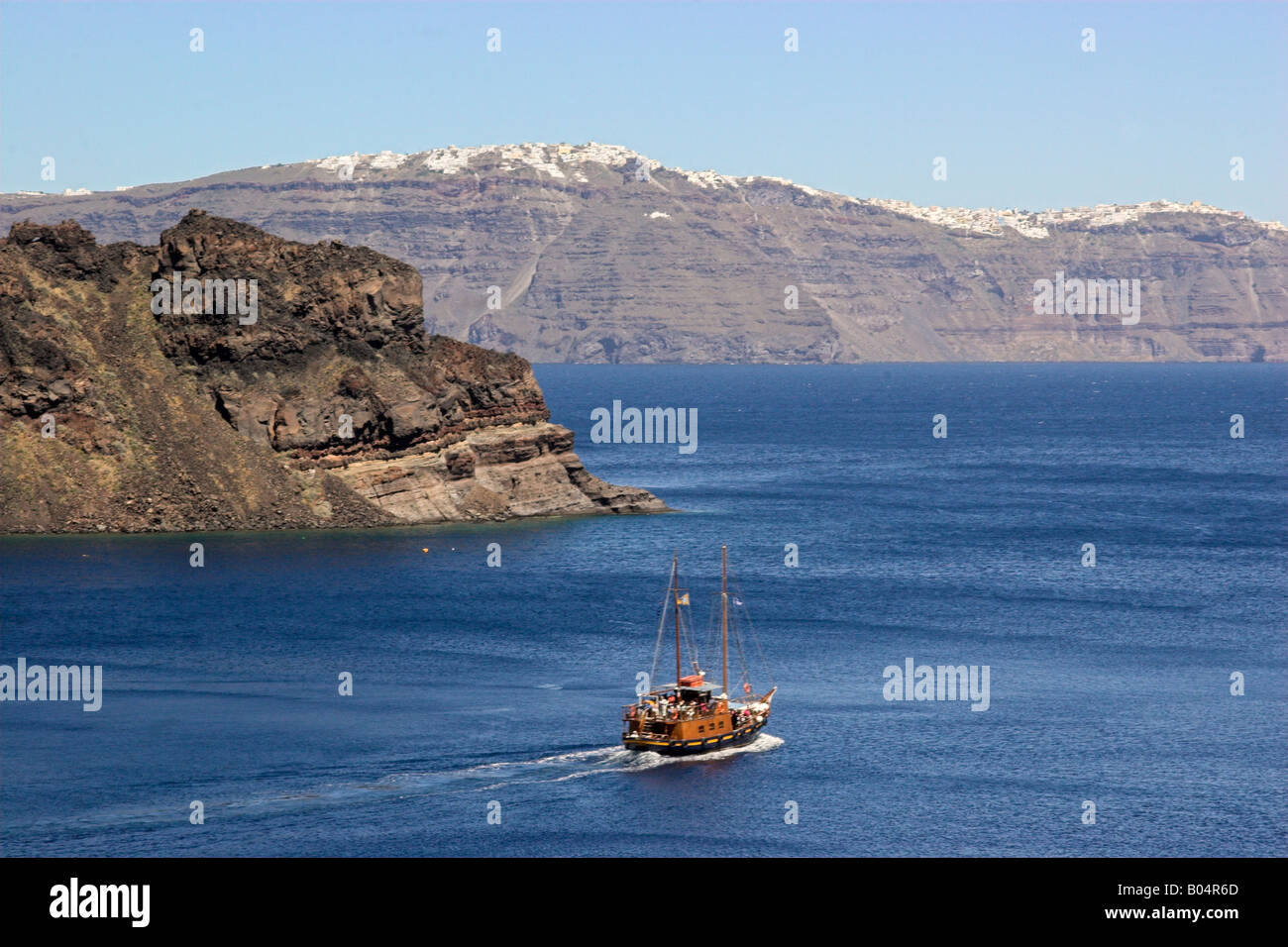 Boat Travelling Between Santorini Islands Stock Photo