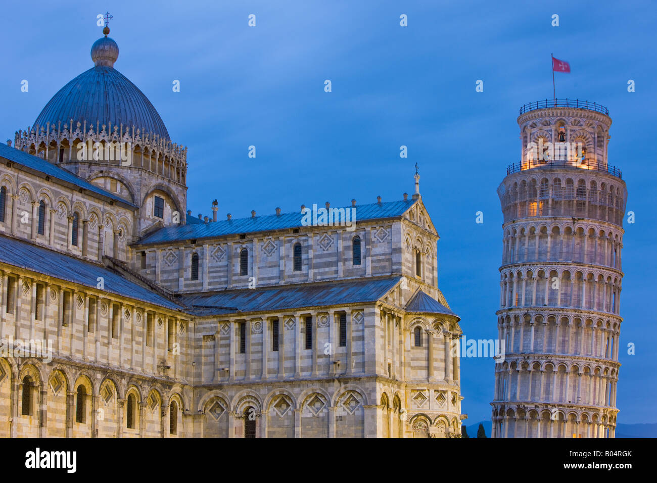 The famous leaning tower of Pisa and Pisa Duomo at dusk in Piazza del Duomo (Campo dei Miracoli), a UNESCO World Heritage Site Stock Photo