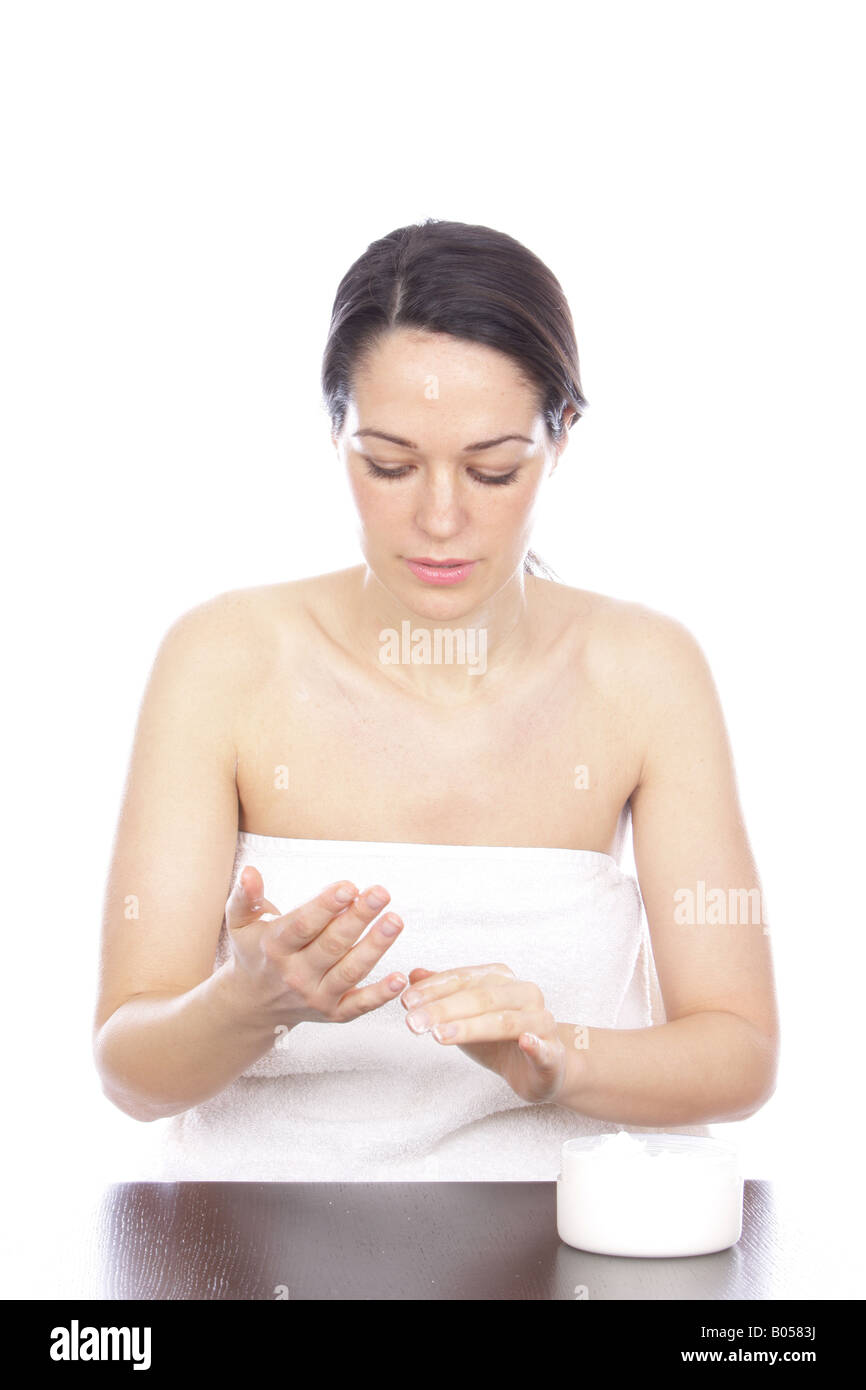 Young Woman Applying Body Cream Model Released Stock Photo Alamy