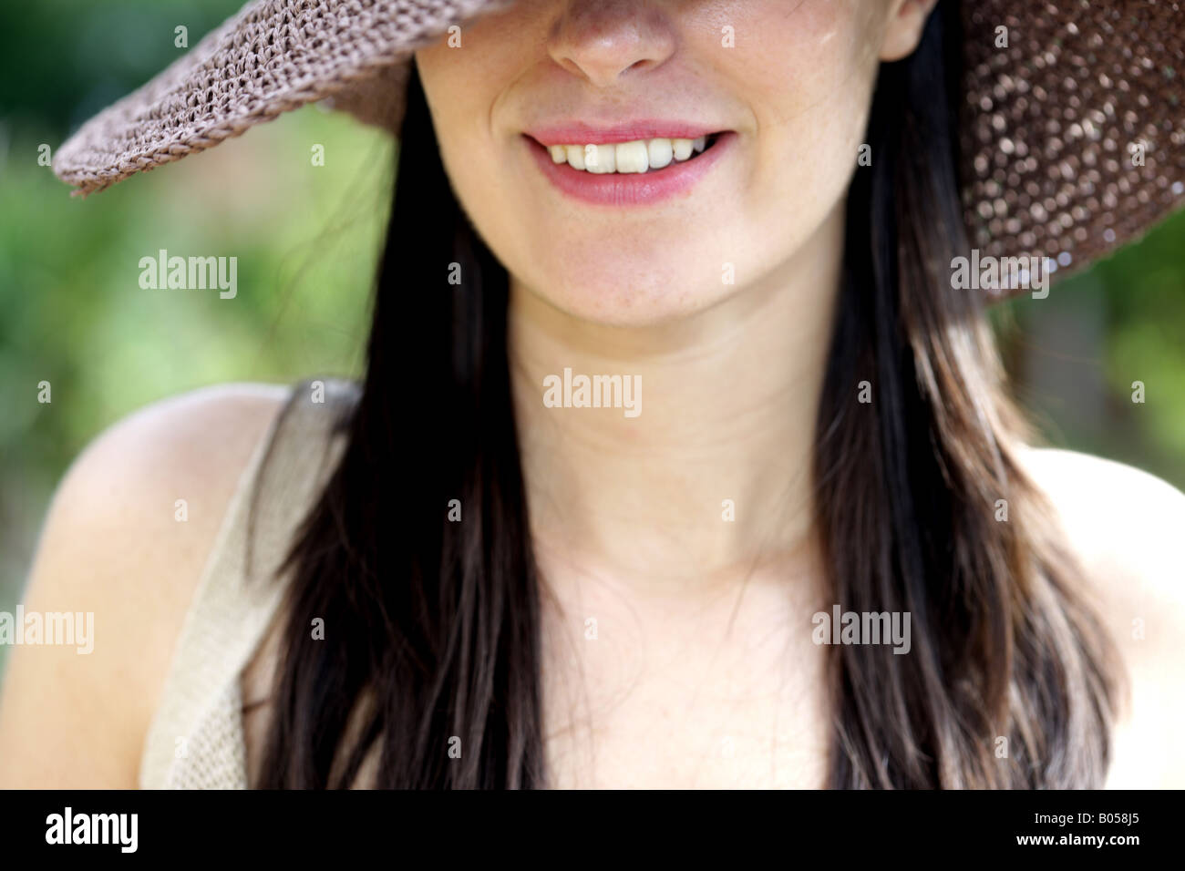 Happy Young Woman Wearing A Straw Hat Model Released Stock Photo - Alamy