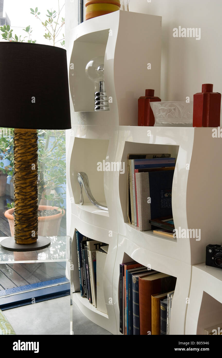 Modern white shelving units in contemporary London apartment Stock