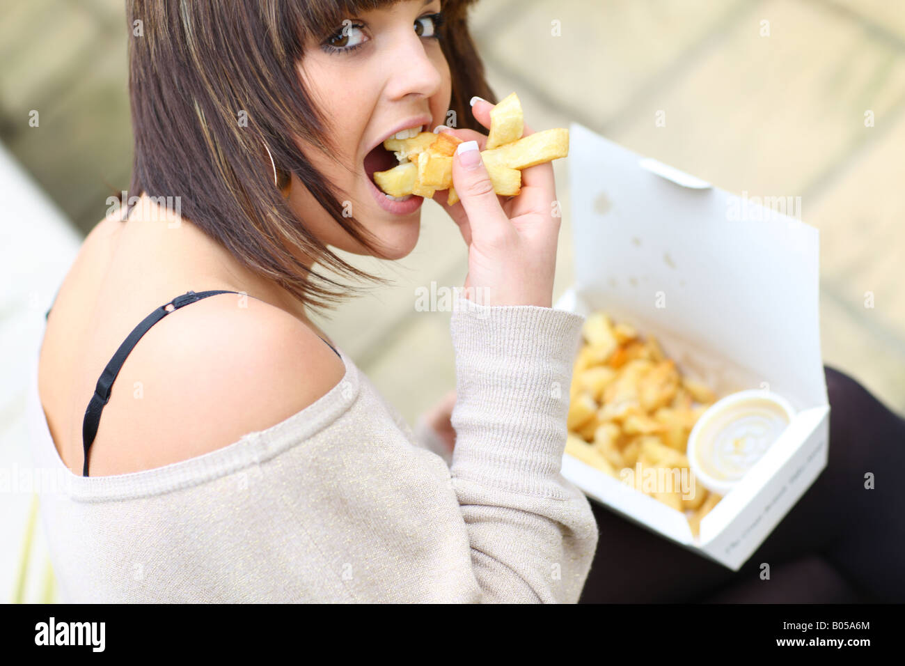 Teenage Girl Eating Chips Model Released Stock Photo Alamy