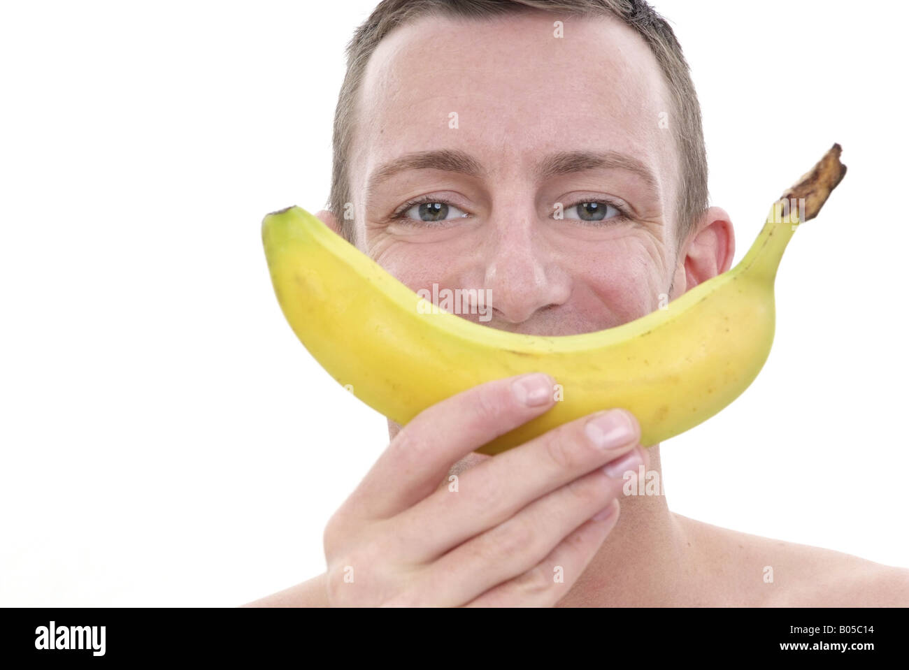 young man with banana mouth Stock Photo Alamy
