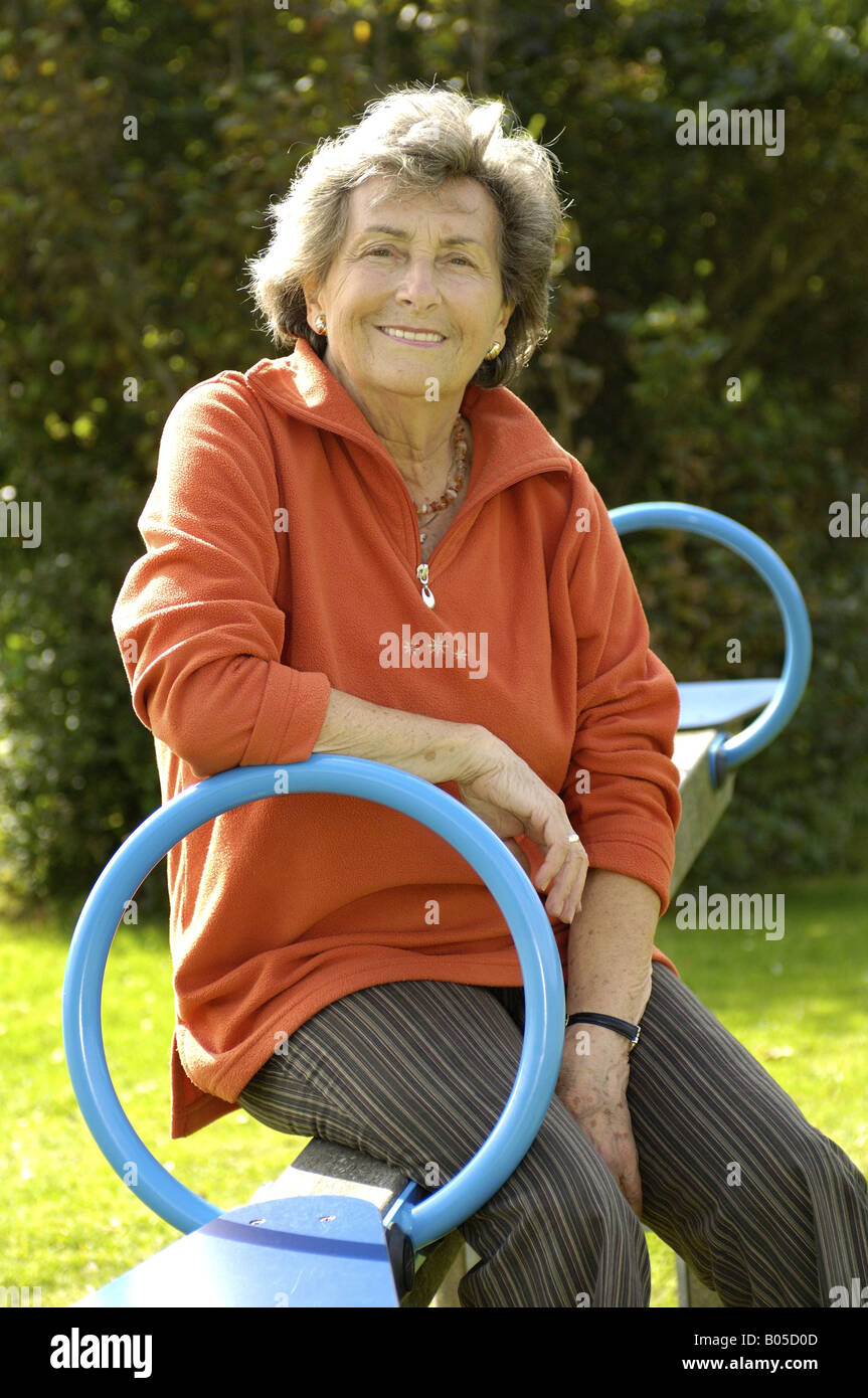 Older woman swinging hi-res stock photography and images - Alamy