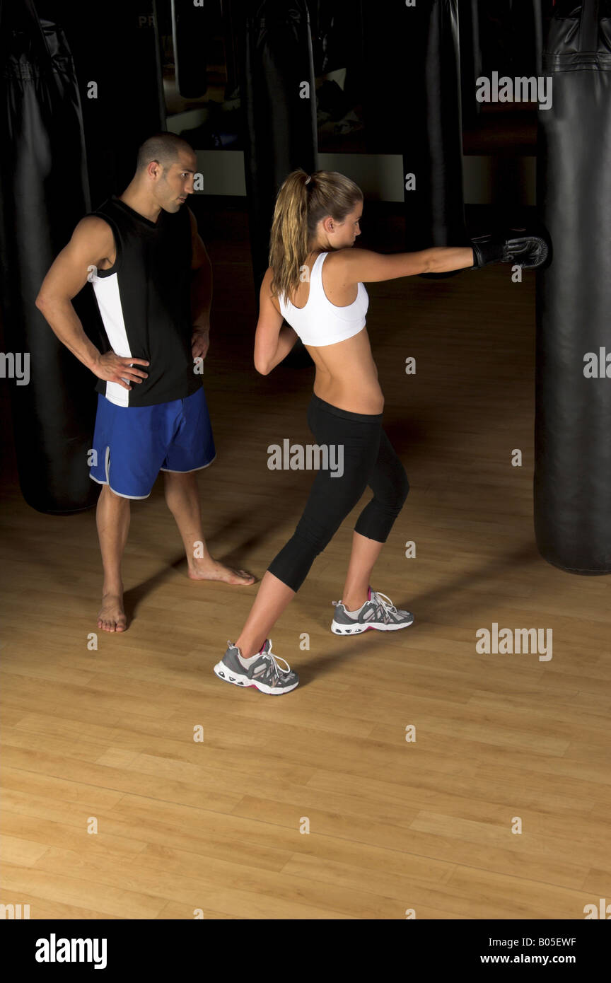 beautiful but dangerous woman fighter working on her right cross with