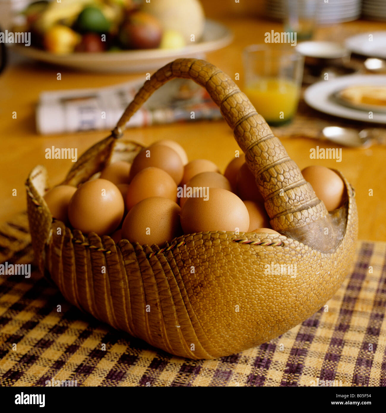 egg basket made from armadillo skin on a breakfast table in South Africa Stock Photo