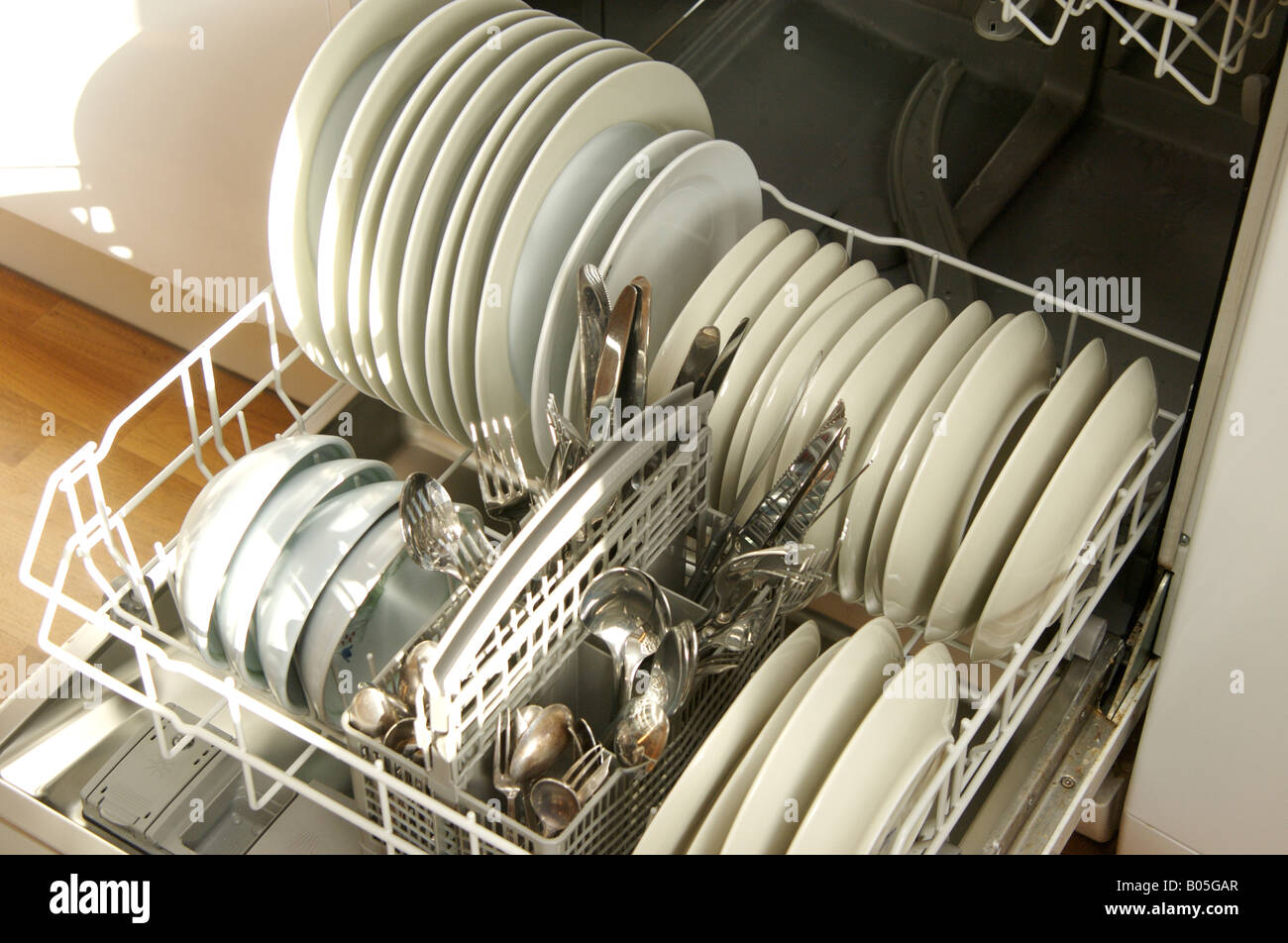 Dishwasher full of clean crockery Stock Photo Alamy