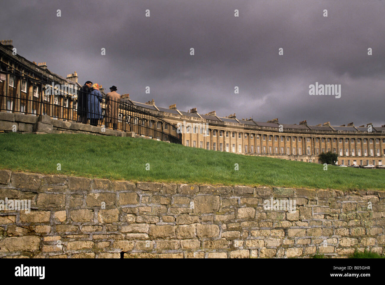 Tourists walk above the Ha ha in front of The Royal Crescent, Bath, Somerset, England Stock Photo