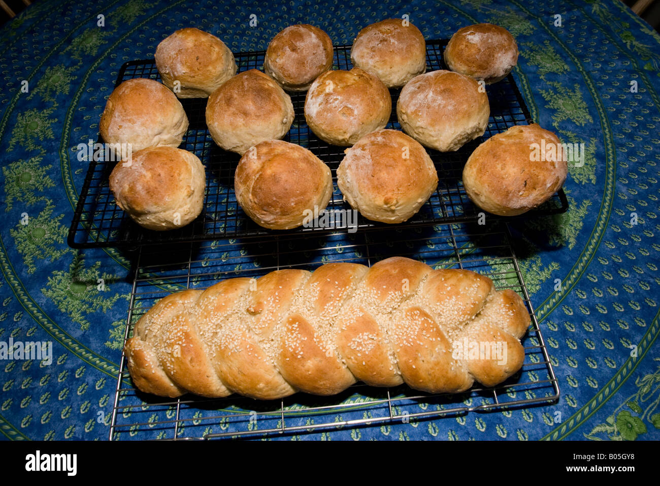 Tray of freshly made home baked rolls and plaited loaf UK Stock Photo