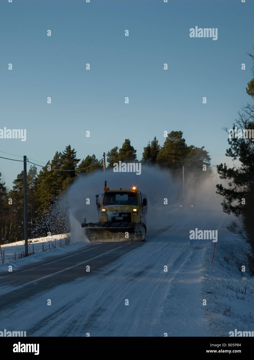 A snow plow keeping the roads clean Stock Photo