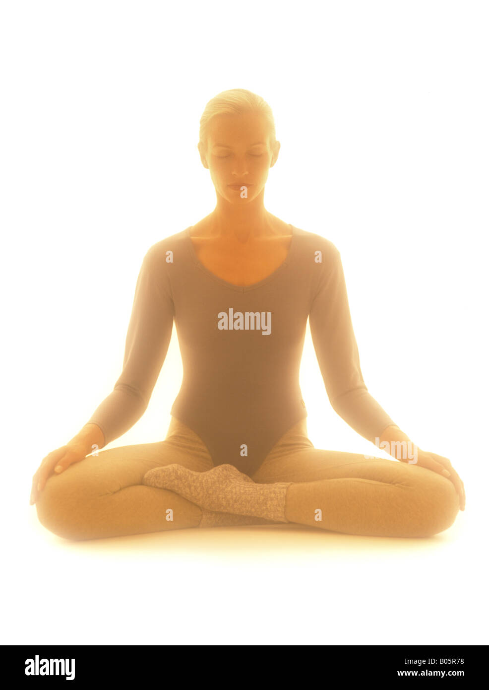 Woman in lotus position Stock Photo