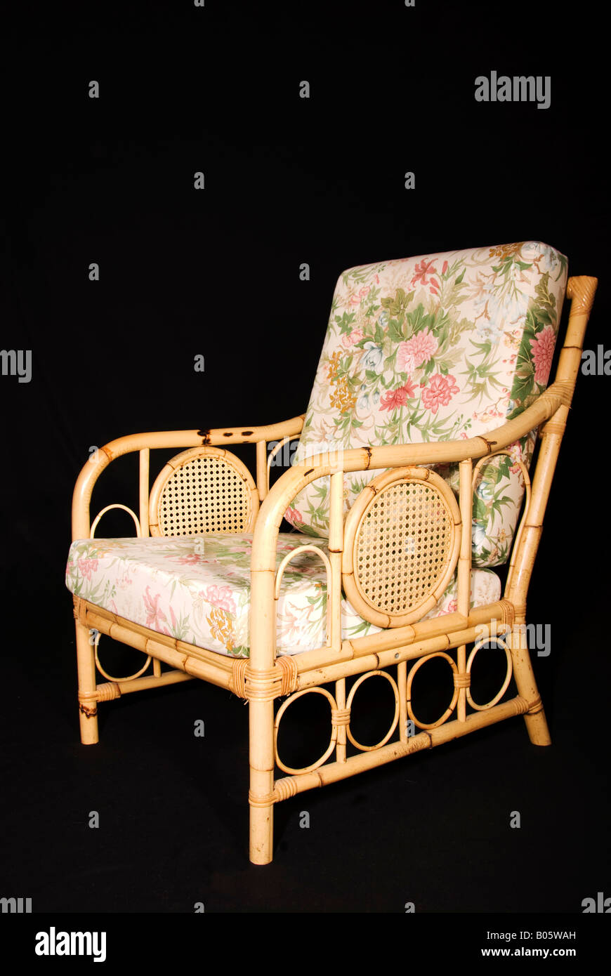 wicker conservatory chair with floral cushions Stock Photo Alamy
