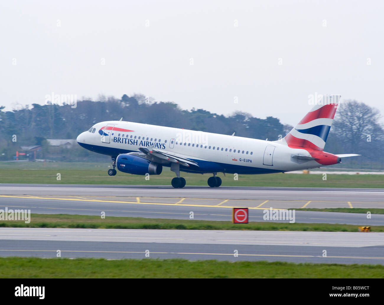 British Airways Airbus A319-131 Takes Off on Runway 05L at Manchester Ringway Airport Greater Manchester England United Kingdom Stock Photo